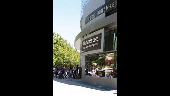 Delegates taking a tour of California State University Sacramento bookstore